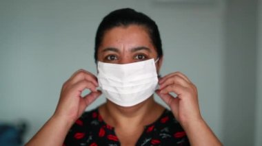 Black african american woman removing face mask prevention