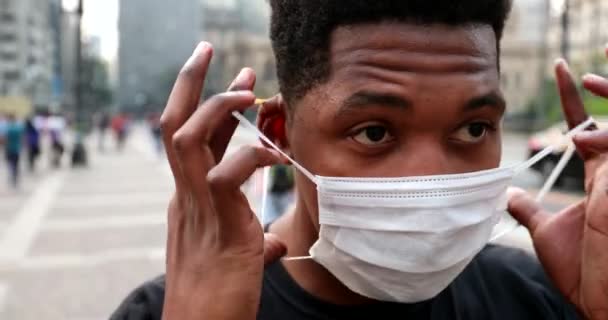 African Male Removing Covid Face Mask Downtown City — Video