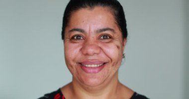 Black woman portrait smiling to camera. Happy african american adult woman face