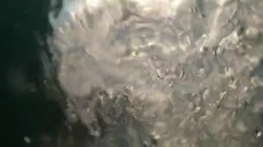 Going underwater surface, POV camera going under water, diving and splashing