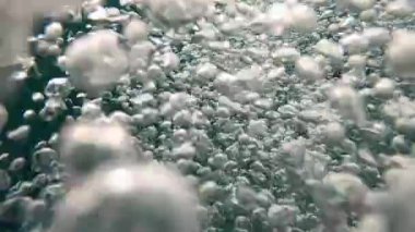 Person POV at lake water emerging into surface