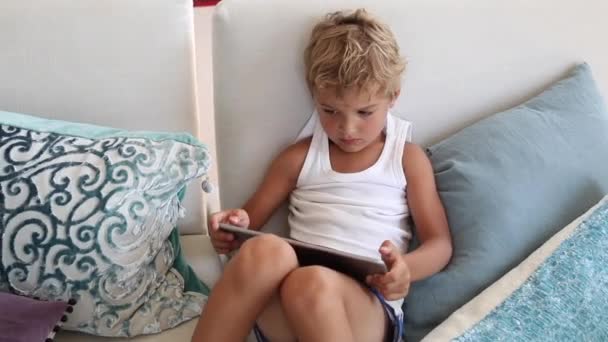 Candid Child Playing Games Tablet Device Kid Sitting Home Couch — Stock videók