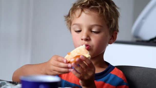 Candid Little Boy Morning Breakfast Table Eating Bread Jelly — Stockvideo