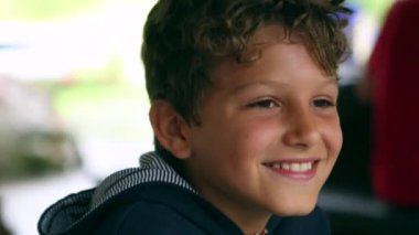 Handsome young boy child smiling to camera