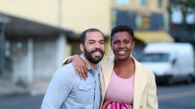Interracial mix race couple smiling at camera, ethnically diverse married couple