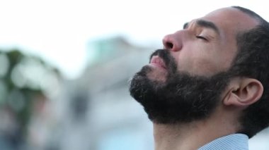 Faithful 40 year old man looking at sky with hope