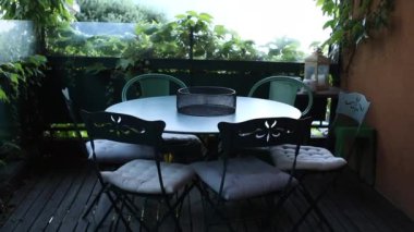 Balcony chairs and table outside home