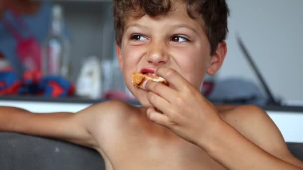 Pensive Preteen Boy Eating Piece Bread — Stockvideo