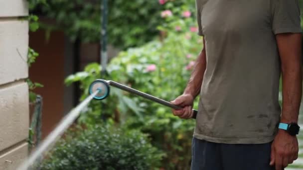 Young Man Watering Garden Person Spraying Water Backyard — Vídeo de Stock