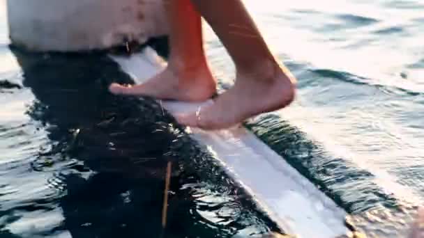 Child Legs Keeping Balance Metal Structure Lake Water — стоковое видео
