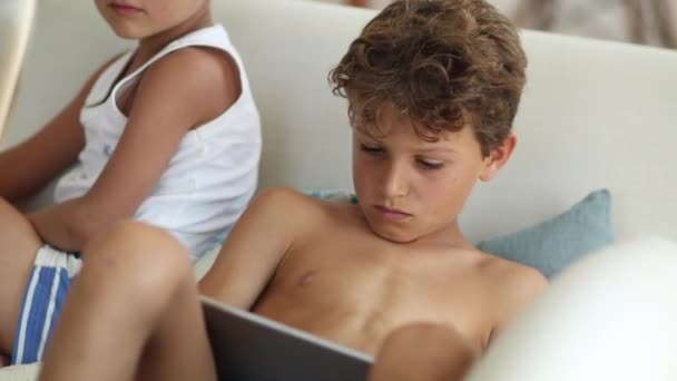 Boys Sitting Sofa Watching Entertainment Media Tablet — Video Stock