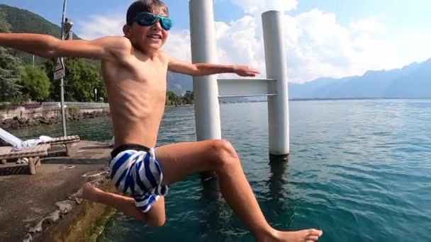 Child Jumping Lake Water — Vídeos de Stock