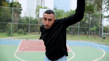 Man dancing street dance. Hispanic guy freestyle urban dance