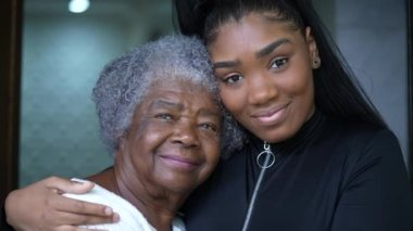 Grandmother and granddaughter together portrait faces