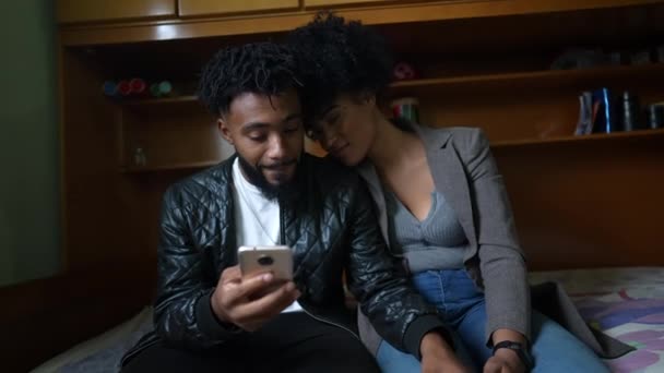 Black Couple Staring Phone Browsing Online Content Two People Looking — ストック動画