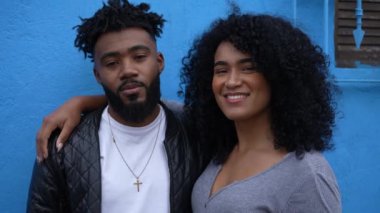An African couple portrait faces laughing and smiling two Brazilian people