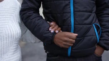 Eldery mother and adult son relationship hands together