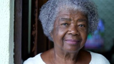 Portrait of a senior black woman face close-up looking at camera