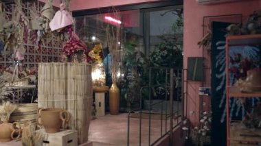 Interior of Flower Shop with decoration. Small business store studio. Decorations arrangements and gifts. Service and sale of home plants