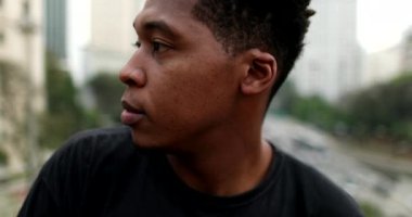 Pensive black African american man in city