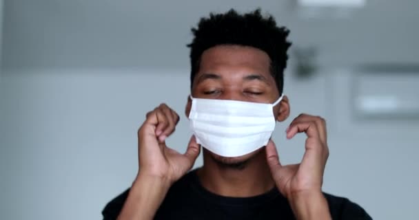 Young Black Man Putting Adjusting Surgical Face Mask — Video