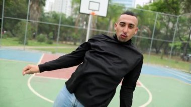 Man dancing street dance. Hispanic guy freestyle urban dance