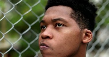 Pensive African black man thinking outside