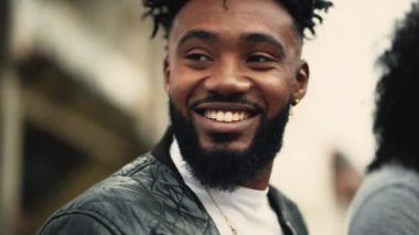 A handsome black man face smiling at camera