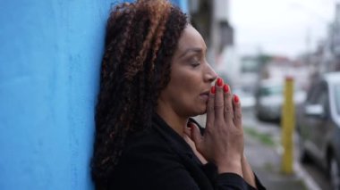 A preoccupied black person feeling stress and anxiety