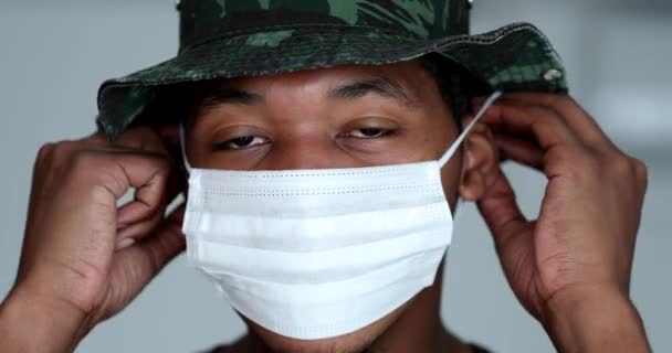 Young African Man Putting Face Mask Prevention — ストック動画