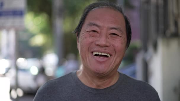 Happy Asian American Senior Man Smiling Camera While Walking Outdoors — Stock videók