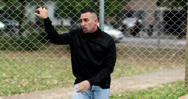 Hispanic Guy Leaning Metal Fence Latino South American Person — Video