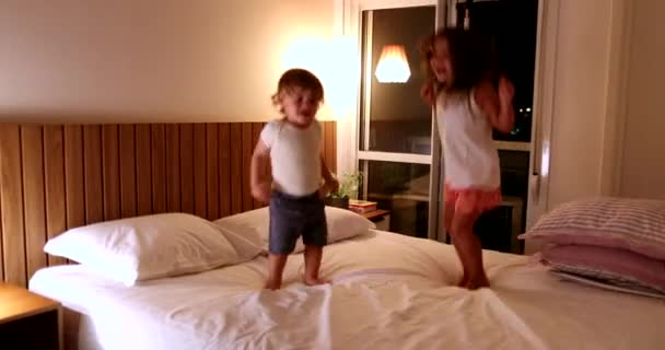 Happy Children Bounding Bed Night Little Girl Toddler Boy Jumping — Vídeos de Stock