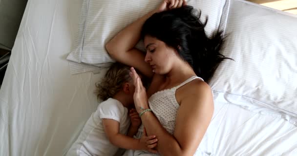 Mother Cuddling Breastfeeding Infant Baby One Year Old Toddler Bed — Stockvideo