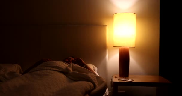Person Turns Night Stand Light Gets Out Bed — Stock Video