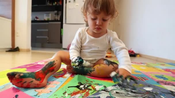 Messy Toddler Baby Playing Colorful Painting Living Room — Stockvideo