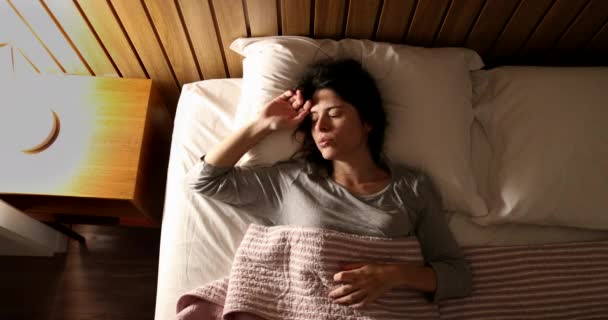 Woman Bed Turning Nightstand Light — стоковое видео
