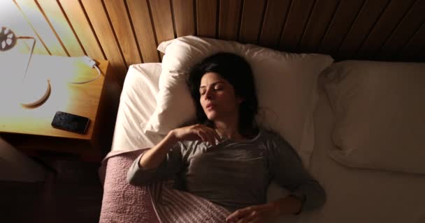 Worried Sleepless Woman 30S Lying Bed Unable Sleep — стоковое видео