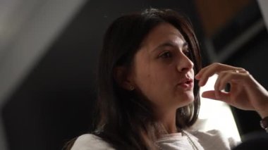Casual woman in conversation talking among friends explaining concerns