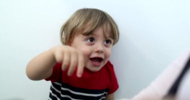 Baby boy hitting with hands, energetic child