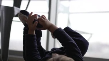 Toddler removing socks from feet clothing
