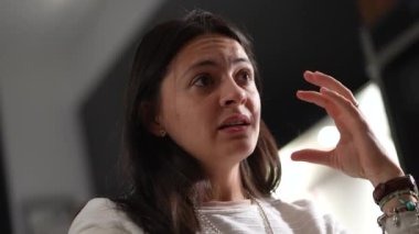 Casual woman in conversation talking among friends explaining concerns
