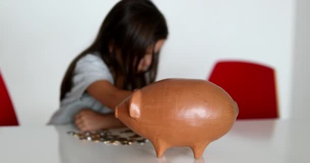 Little Girl Saving Money Piggy Bank — Video Stock