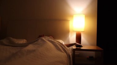 Woman getting out of bed. Person gets up at night