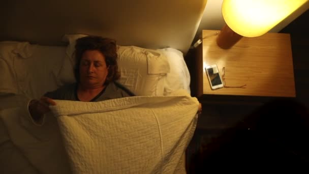 Older Woman Lying Bed Blanket Preparing Sleep Senior Lady Picks — Stockvideo