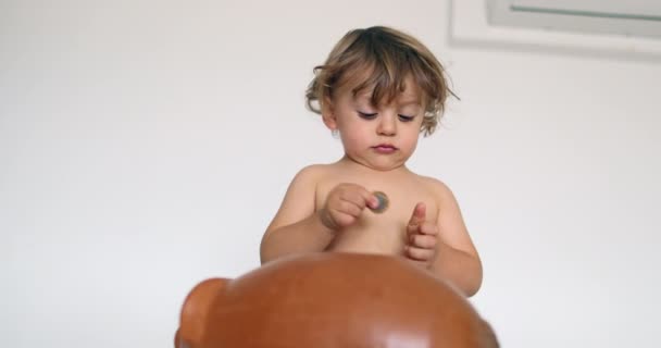 Toddler Boy Saving Money Inserting Coins Piggy Bank — Vídeos de Stock