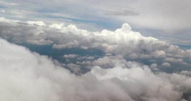 Clouds in the sky flying plane window