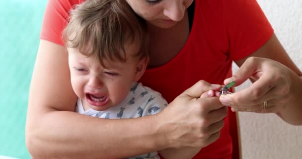 Mother Trimming Crying Baby Nails Parent Cutting Clipping Infant Toddler – Stock-video