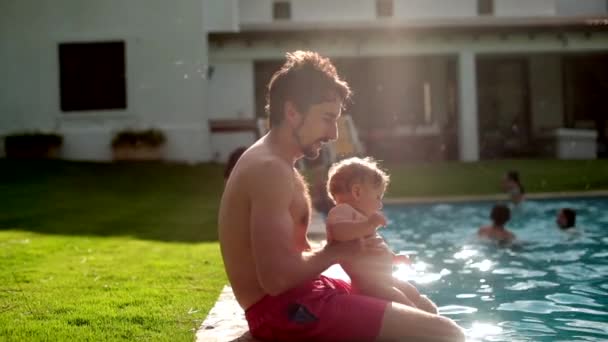 Father Holding Baby Infant Swimming Pool Backyard Outdoors — Vídeo de Stock
