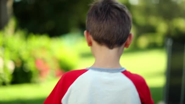 Back Young Boy Walking Out Backyward Home Outdoor Garden — Stock video